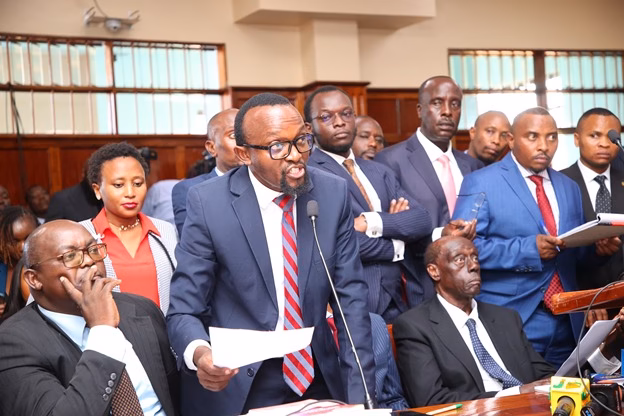 Advocate Ndegwa Njiru speaking passionately into a microphone during a high-profile legal hearing in a Kenyan courtroom.